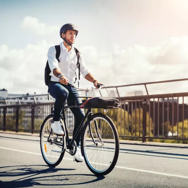 man commuting on bicycle to work