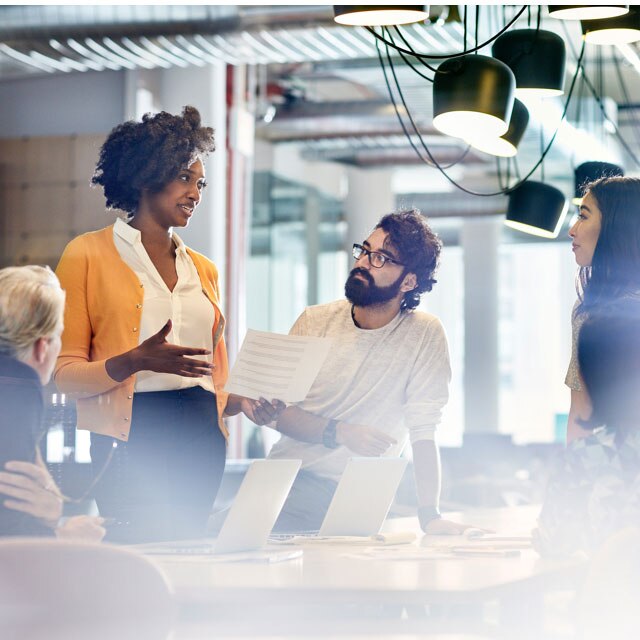 office workers collaborating around a table