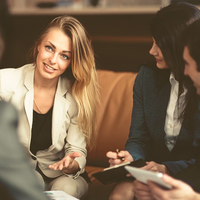 Needs to be changed with woman in a meeting