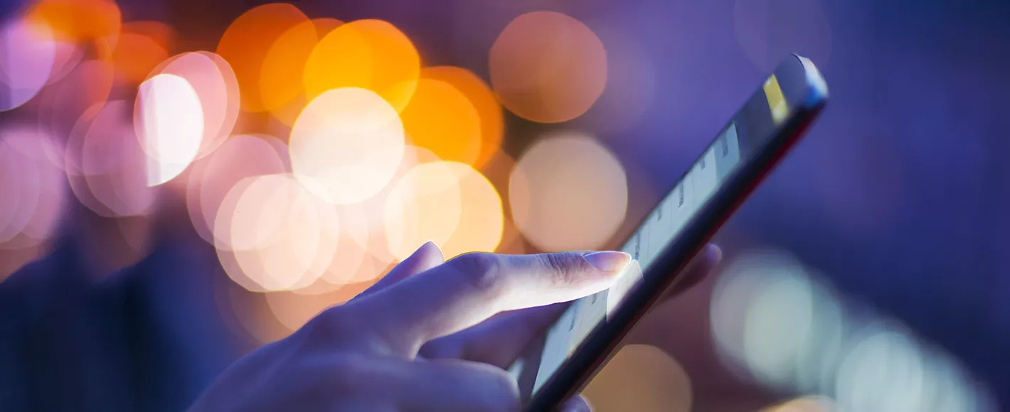 woman looking at mobile phone