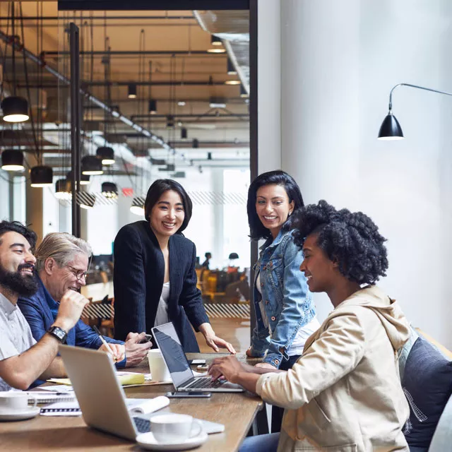 office workers collaborating around a table
