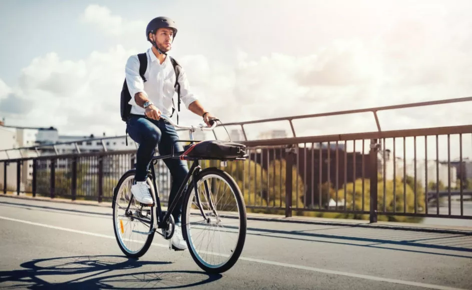 man commuting on bicycle to work