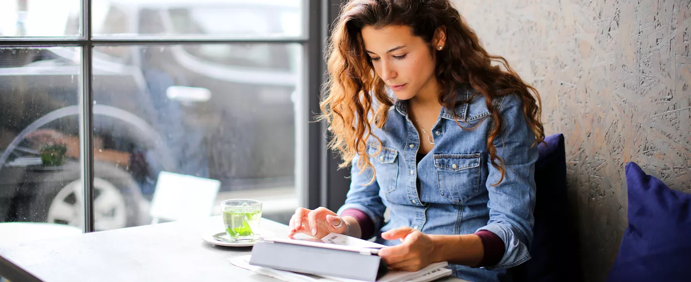 woman looking up where to buy nestle pure life bottled water on tablet