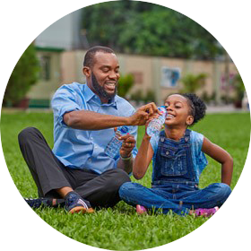 Man sharing Nestle Pure Life water with daughter