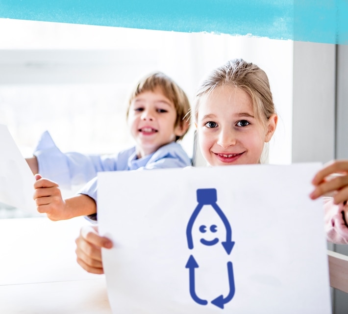 nestle pure life boy and girl holding a drawing