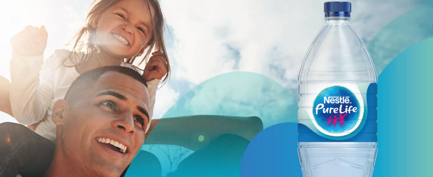 Nestlé Pure Life water bottle beside a family enjoying time outdoors