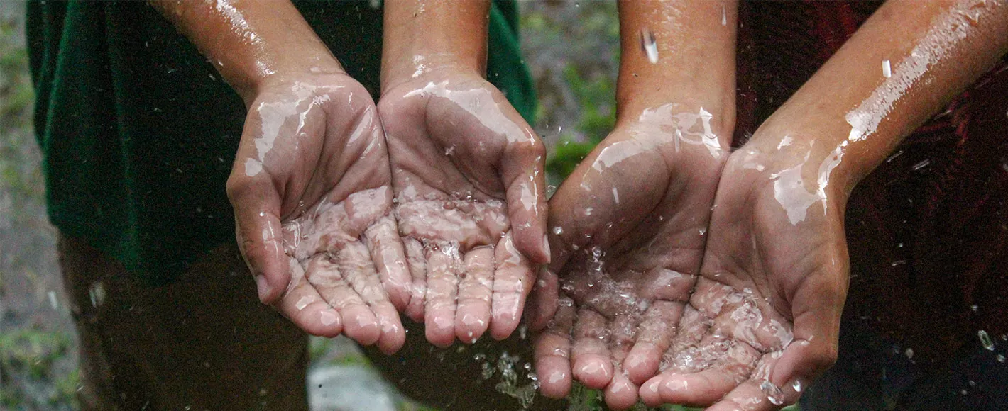 Hands collecting clean water, highlighting access to safe drinking water