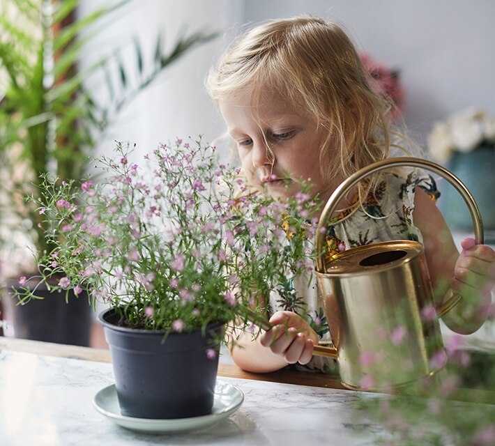 nestle pure life girl watering the flowers