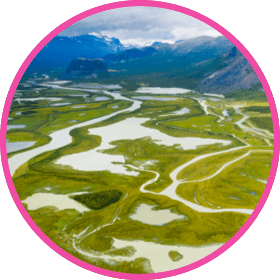 rivers running through grassy vista
