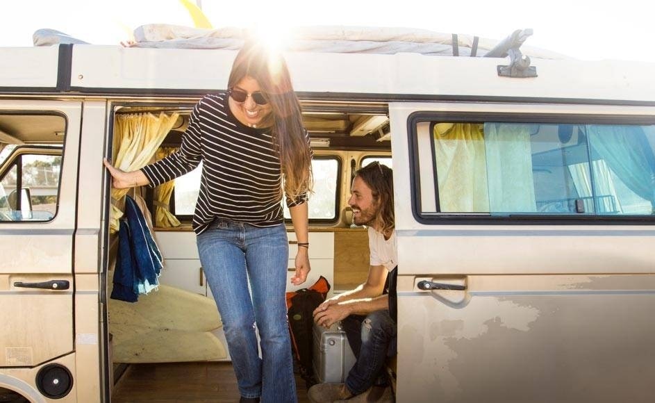 woman getting out of a van 