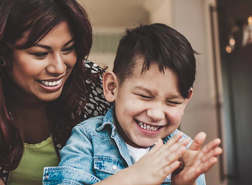 Boy and his mum smiling